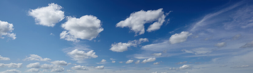 Naklejka na ściany i meble Panoramic photo of blurred sky. Blue sky background with cumulus clouds