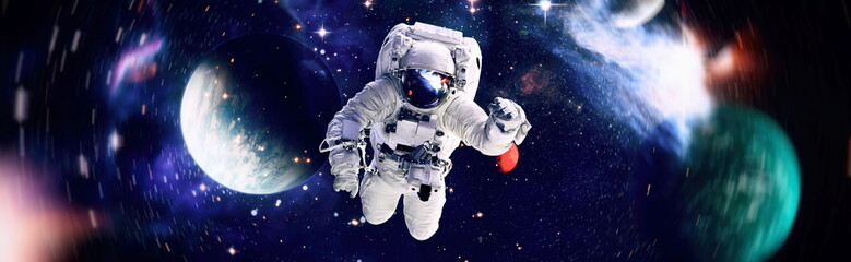 Astronaut in space in the solar system Earth. Blue light on background. Elements of this image...