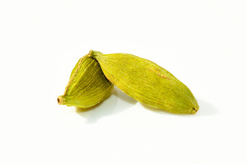 Cardamom pods and seeds isolated on white background