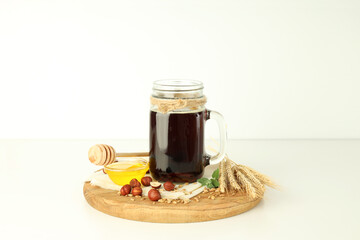 Concept of fresh drink on white table, kvass