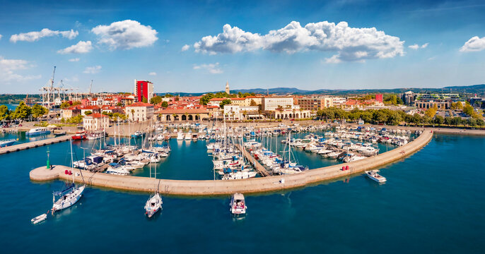 Beautiful summer view from flying drone of Koper port. Sunny outdoor scene of Adriatic coastline, Slovenia, Europe. Splendid Mediterranean seascape. Traveling concept background.