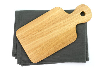Empty wooden tray with cloth isolated on white background. Mock up. Selective focus.