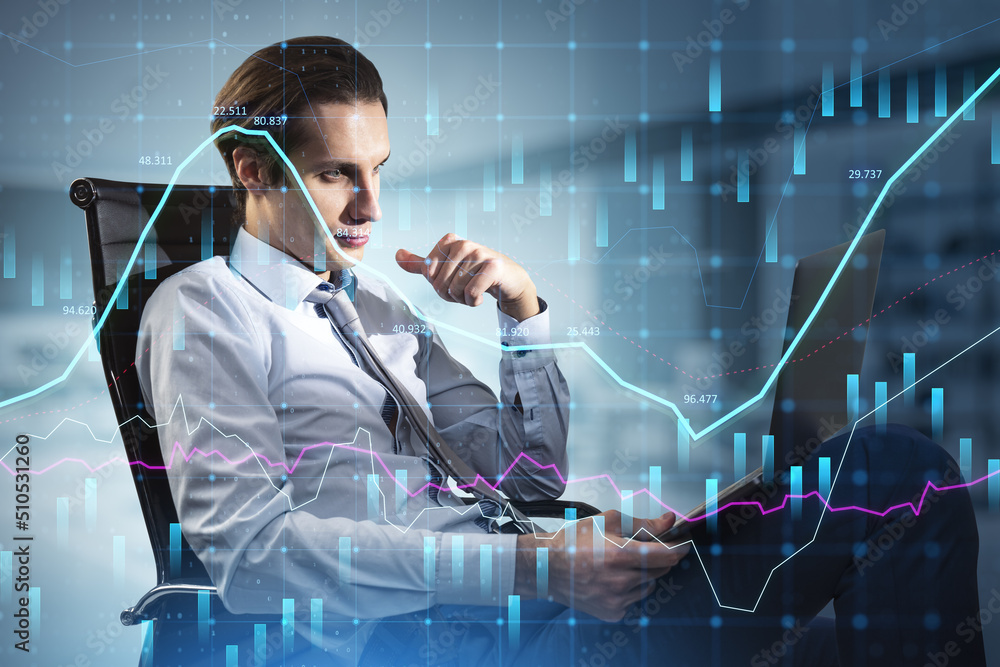 Poster businessman using laptop while sitting in chair with abstract glowing forex graph on blurry backgrou