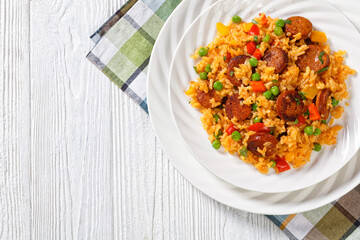 smoked sausages with rice and vegetables, top view