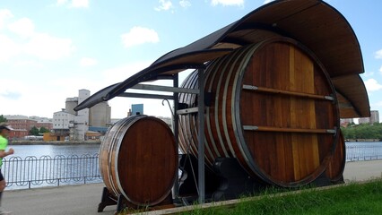 Stockholm, Sweden, June 10, 2022: A glimpse of a barrel bar along one of the city's canals
