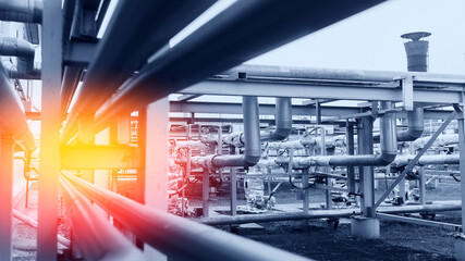 Concept background industrial factory zone. Steel pipelines, valves and ladders modern gas power...