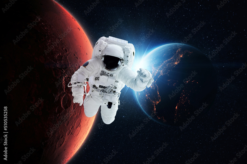 Poster beautiful astronaut flies in zero gravity on a background of the blue planet earth with the rays of 