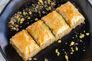 Pistachio baklava. Traditional Mediterranean cuisine delicacies. Baklava on stone background....
