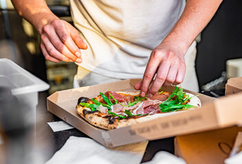 hand of chef baker making pizza at kitchen. The process of making pizza. cooking italian pizza