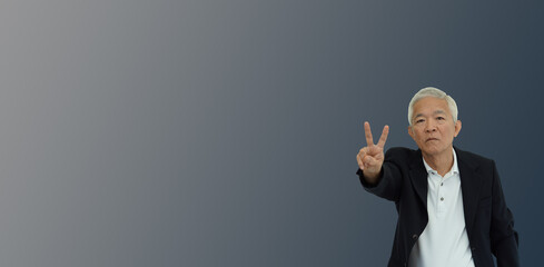 Asian senior businessman with vicotry sign happy success business