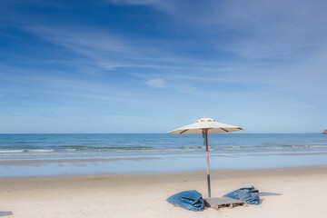 Chair umbrella and lounge on the beautiful beach