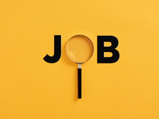Magnifying glass or magnifier with the word job on yellow background. Business job search