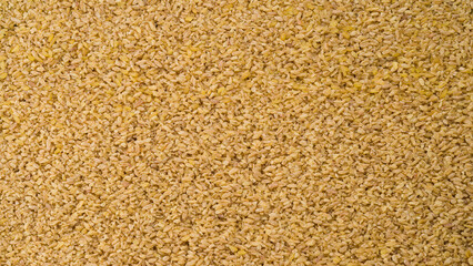Bulgur wheat background. Rice wheat product.