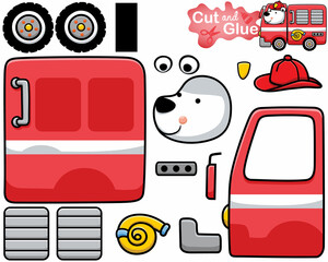 Vector illustration of cartoon polar bear wearing fireman helmet on firetruck. Cutout and gluing