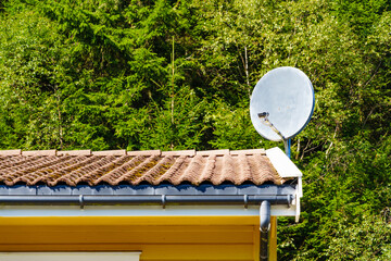 Satellite dish on roof of house