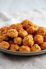 Homemade Crumbly Biscuits with Parmigiano Reggiano on a Plate, low angle view. Close-up.