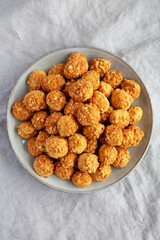 Homemade Crumbly Biscuits with Parmigiano Reggiano on a Plate, top view. Flat lay, overhead, from above.