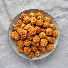 Homemade Crumbly Biscuits with Parmigiano Reggiano on a Plate, top view. Flat lay, overhead, from above.