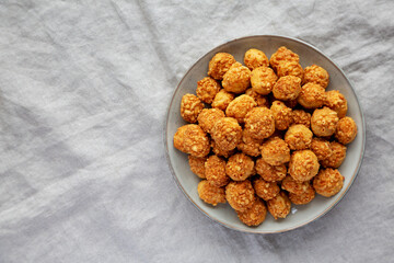 Homemade Crumbly Biscuits with Parmigiano Reggiano on a Plate, top view. Flat lay, overhead, from above. Space for text.