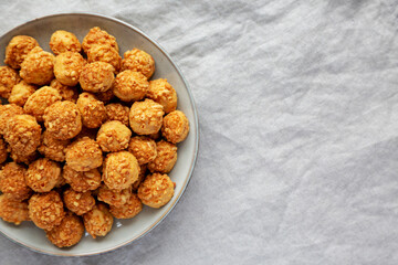 Homemade Crumbly Biscuits with Parmigiano Reggiano on a Plate, top view. Flat lay, overhead, from above. Copy space.