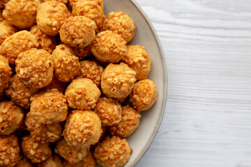 Homemade Crumbly Biscuits with Parmigiano Reggiano on a Plate, top view. Flat lay, overhead, from above. Copy space.