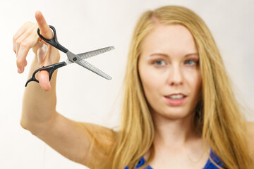 Girl with scissors thinning shears