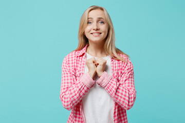Young worried fun pleading blonde caucasian woman she 30s wears pink shirt white t-shirt waiting...