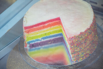 Colourful rainbow cake at a bakery in Brick Lane market in London