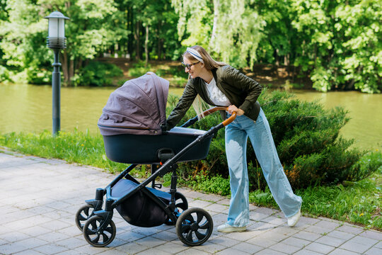 Motherhood, a walk in the park, a young mother