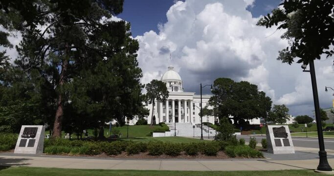 Alabama state capitol in Montgomery with gimbal video walking through trees in slow motion.