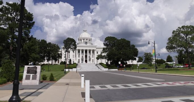 Alabama state capitol in Montgomery with gimbal video walking forward on street level.