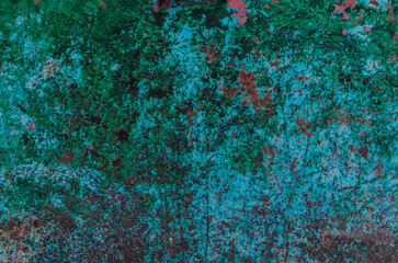Aged green background with peeling paint. Grunge background. Old scratched painted surface.