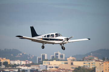 White private airplane landing in the aeroclub
