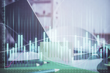 Stock market graph and table with computer background. Multi exposure. Concept of financial analysis.