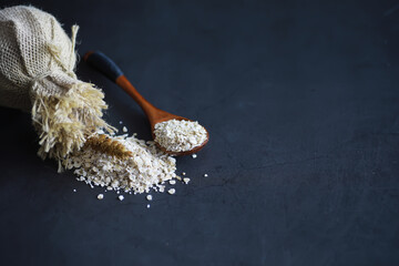World grain crisis. A handful of cereals and on a dark background.