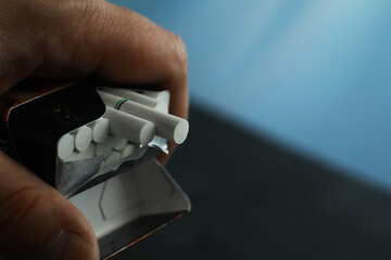 Tobacco smoking. Cigarettes in a pack. Harmful deadly habit of smoking.