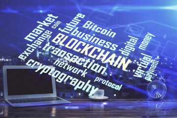 Multi exposure of blockchain theme hologram and table with computer background. Concept of bitcoin...