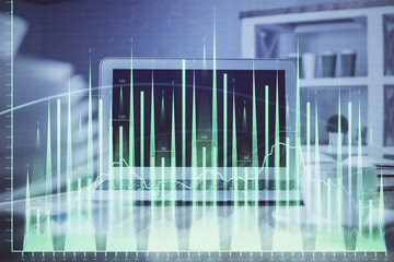 Stock market graph and table with computer background. Multi exposure. Concept of financial analysis.