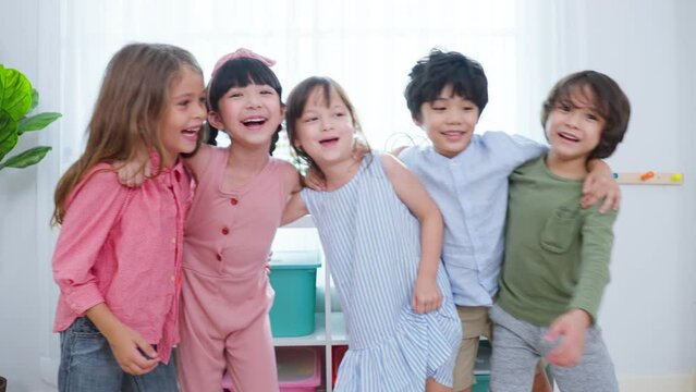 Mixed race Group of young children student playing together in school.