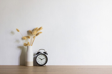 Minimal concept with natural flowers with clock.