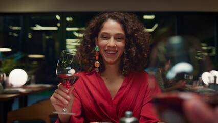 Happy woman drinking wine on date pov. Sexy african american lady in restaurant.