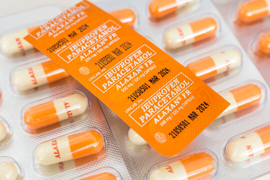 Philippines - May 2022: 200 mg Alaxan FR capsules in blister packs. Brand name for Ibuprofen and Paracetamol. Over the counter pain medication for sale at a pharmacy or drug store.