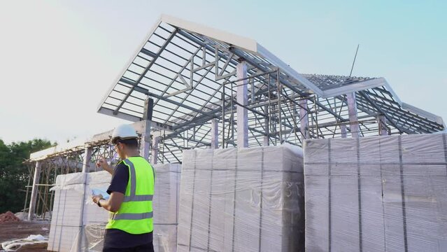 A engineers,handsome faces from asia are working on Inspection lightweight bricks,AAC in house and building construction projects.
