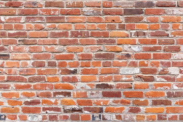 brick wall of an old american building with original bricks from 19th century