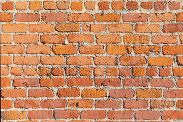 brick wall of an old american building with original bricks from 19th century