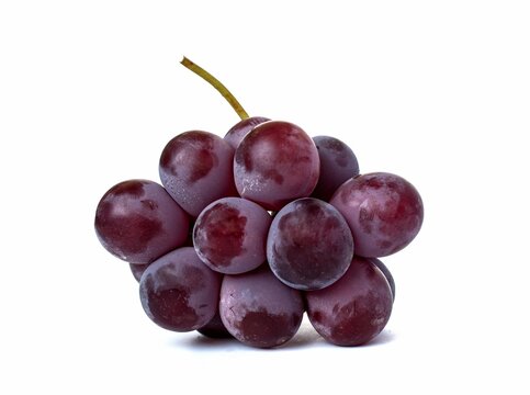 Bunch of red grapes dark delicious sweet fruit isolated on white background