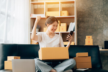 Asian woman working in modern warehouse and delivery service via modern technology