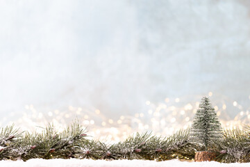 Christmas ornament with string lights on blue background.