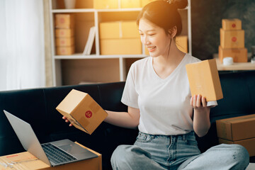 Asian woman working in modern warehouse and delivery service via modern technology