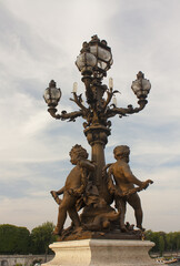 Fototapeta na wymiar Sculptures of Bridge of Alexander III in Paris, France 